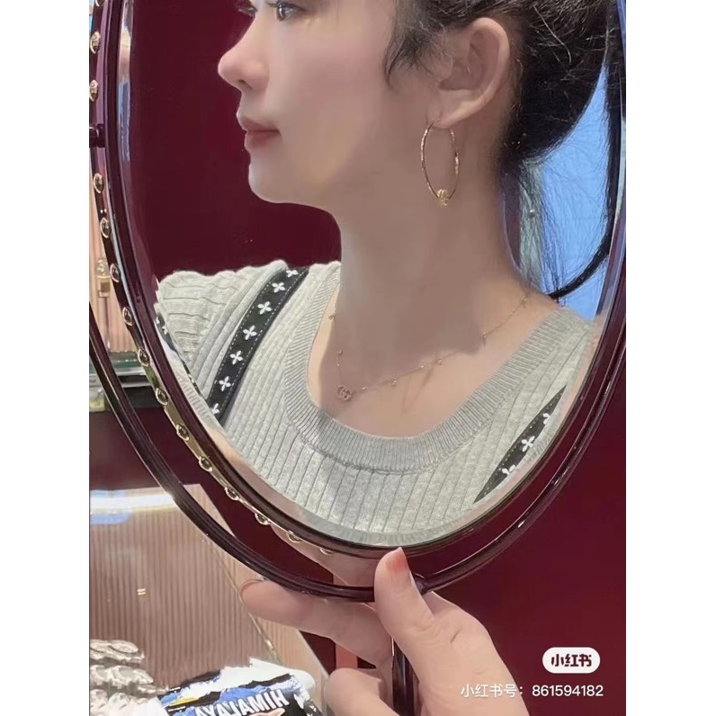 G*u*i earrings